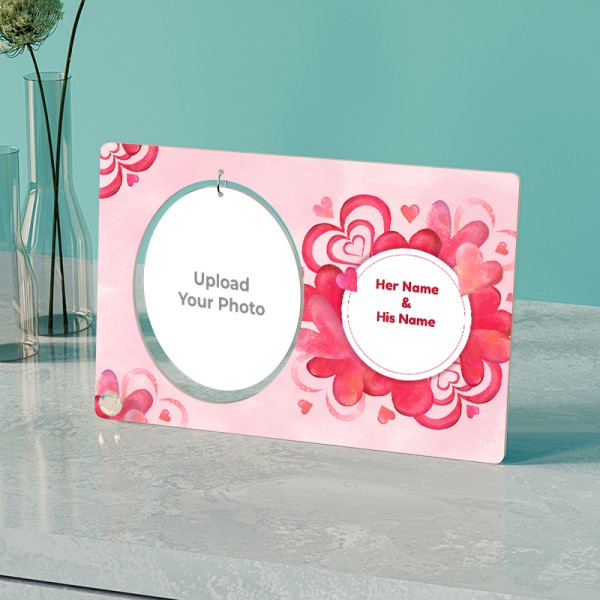 Names On Hearts In Background With Oval Shaped Hanging Photo Stand